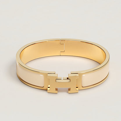 https://assets.hermes.com/is/image/hermesproduct/clic-h-bracelet--700001F%2085-front-wm-1-0-0-1000-1000_g.jpg